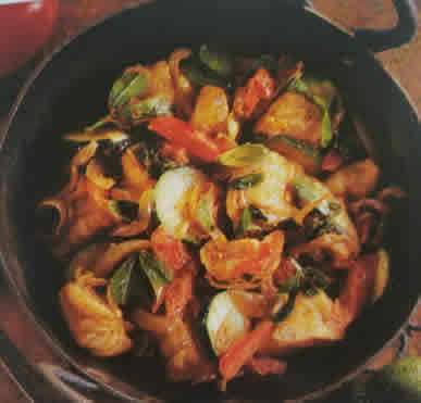 Bowl of stir-fried vegetables with cod fish.