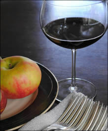 Wineglass with plate of fruit