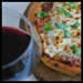 glass of red wine with pizza