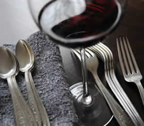 glass of Italian red wine with silverware